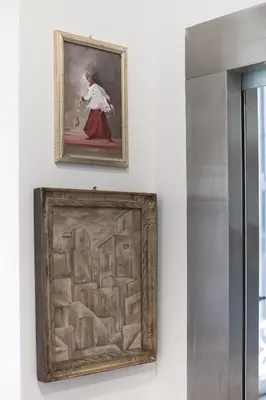 two framed paintings of a woman on a wall at Casa Albani in Rome