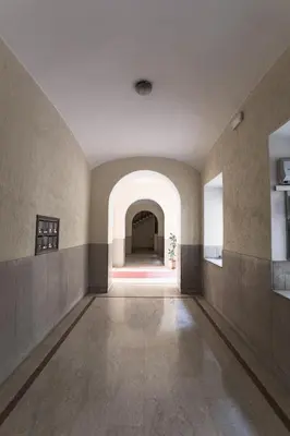 an empty hallway with an archway in a building at Casa Albani in Rome