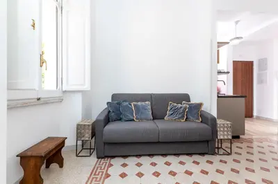 a living room with a couch and a table at Trastevere novecento in Rome