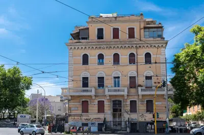 an old building on the corner of a street at Trastevere novecento in Rome