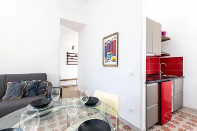 a living room with a glass table and a couch at Trastevere novecento in Rome