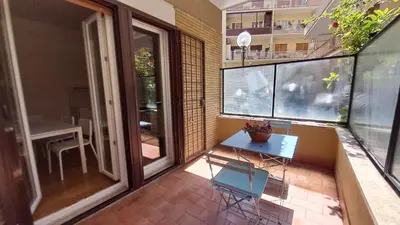 a small balcony with a table and chairs on it at Roberta Rome Vatican Flat in Rome
