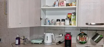 a counter top with a coffee maker and breakfast food at Bribry Home in Rome