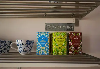 a shelf with three coffee cups on it at Vatican Dolce Vita in Rome