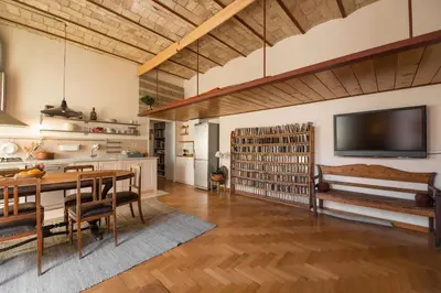 a large living room with a table and a tv at Vatican Dolce Vita in Rome