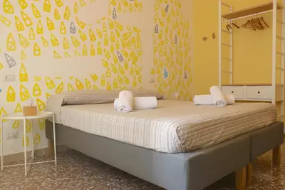 a bedroom with a bed with white towels on it at Rome Sleep Home Bed & Breakfast in Rome