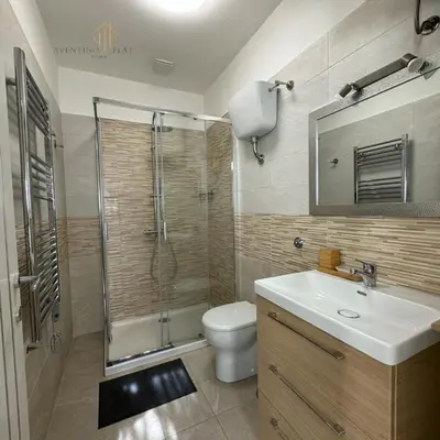 a bathroom with a shower and a toilet and a sink at Aventino Flat in Rome