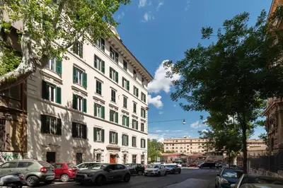 a city street with cars parked in front of buildings at Casa Dandolo - Pretty Homes in Rome