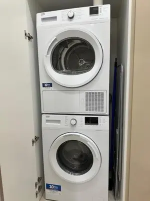 a washing machine and a dryer in a room at BALDO 352 HOME in Rome