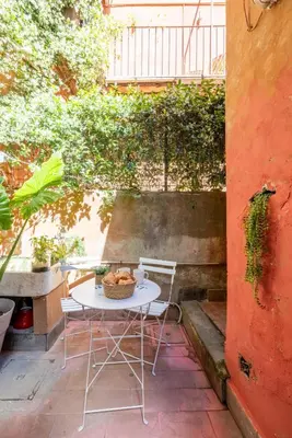 a table and chairs sitting on a patio at Domus Fori Imperiali in Rome