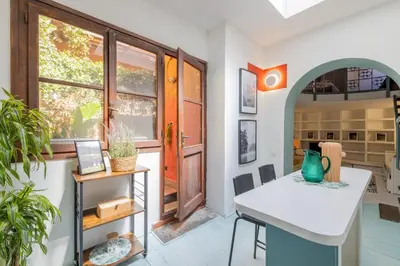a dining room with a table and a window at Domus Fori Imperiali in Rome