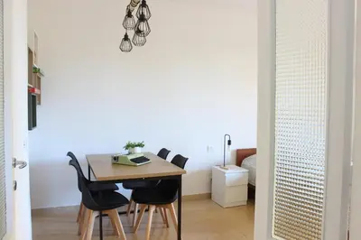 a dining room with a table and chairs at Ponentino B&B in Rome