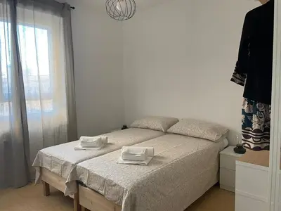 a bedroom with a bed with two towels on it at Ponentino B&B in Rome