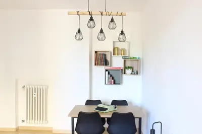 a dining room with a table and two chairs at Ponentino B&B in Rome