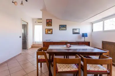 a dining room with a table and chairs at FCR Rome Apartments Ponte Milvio - Fleming in Rome