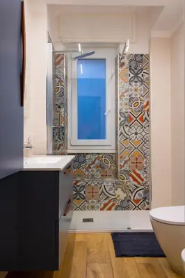 a bathroom with a window and a sink and a tub at Casa Daniela in Rome