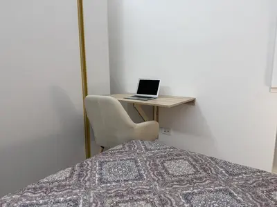 a bedroom with a bed and a laptop on a desk at Rome at Hand in Rome