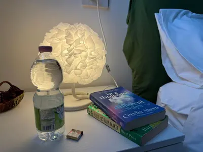 a bottle of water sitting on a table next to two books at Rome at Hand in Rome