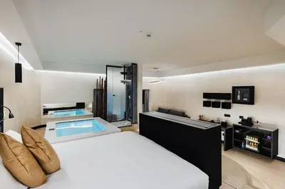 a bedroom with a large bed and a bath tub at Dream Suite Trevi in Rome
