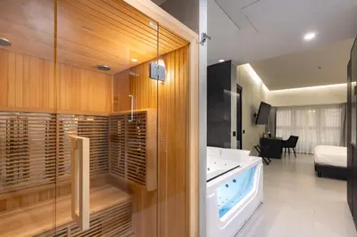 a bathroom with a tub in a room at Dream Suite Trevi in Rome