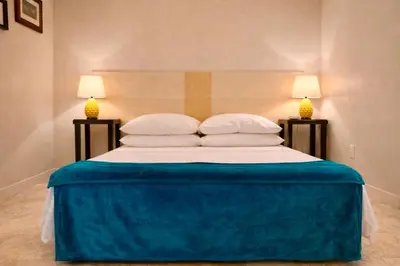 a bedroom with a large bed with two lamps at Madame Sofia Exclusive Collection Spanish Steps - HOME Apartment-Suites in Rome