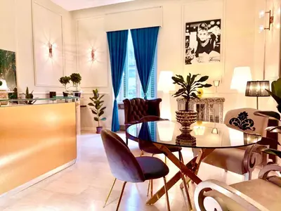 a dining room with a glass table and chairs at Madame Sofia Exclusive Collection Spanish Steps - HOME Apartment-Suites in Rome