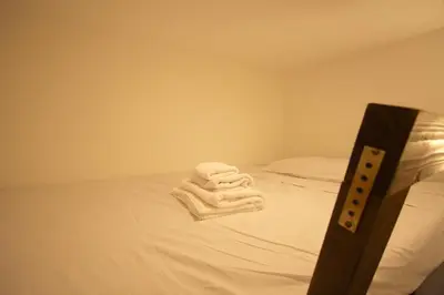 a room with a bed with white towels on it at Testaccio View Holiday House in Rome