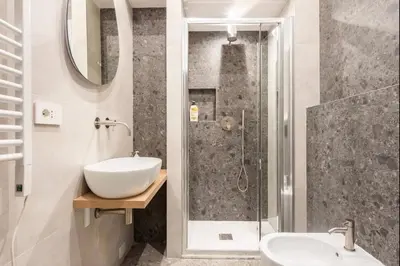 a bathroom with a sink and a shower at Roma private rooms Vatican City in Rome