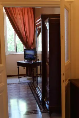 a room with a desk with a laptop on a table at Casa Salimei in Rome