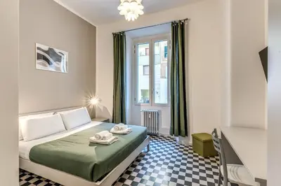 a bedroom with a bed and a window at Orazio's Charming Apartment in Rome