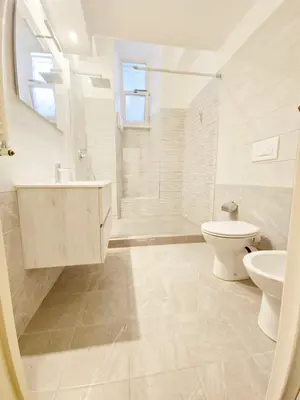 a bathroom with a sink and a toilet and a shower at Like at Home Trastevere in Rome