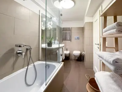 a bathroom with a shower and a tub and a toilet at Banchi Vecchi Stay Apt Suite Pantheon in Rome