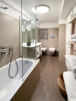 a bathroom with a shower and a tub and a toilet at Banchi Vecchi Stay Apt Suite Pantheon in Rome