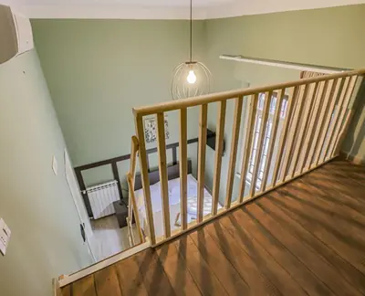 a room with a staircase with a table and a light at Aquas Salvias in Rome