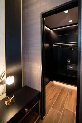 a bathroom with a walk in shower and a mirror at Luxury Rhome Via della Croce in Rome