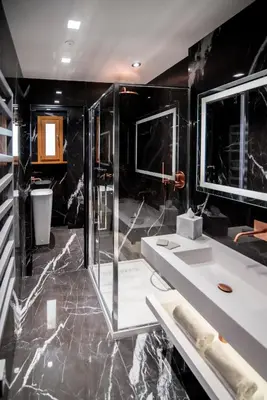 a black bathroom with a shower and a sink at Luxury Rhome Via della Croce in Rome