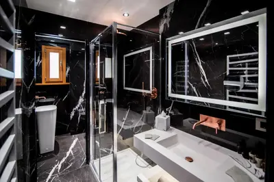 a black bathroom with a sink and a shower at Luxury Rhome Via della Croce in Rome