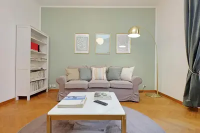 a living room with a couch and a coffee table at YCH-Comfortable 2 bedrooms flat near Colosseum in Rome