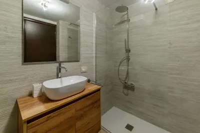 a bathroom with a sink and a shower at GuestHost - Trastevere Three Cozy Rooms in Rome