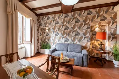 a living room with a couch and a table at Roma Centro Storico Luxury - Piazza di Spagna in Rome