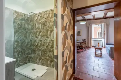 a bathroom with a glass shower in a room at Roma Centro Storico Luxury - Piazza di Spagna in Rome