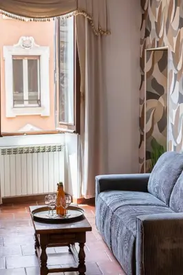 a living room with a couch and a table at Roma Centro Storico Luxury - Piazza di Spagna in Rome