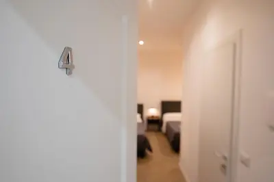 a door with a number four on it in a bedroom at Vatican 23 Museum Suites in Rome