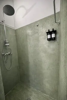 a bathroom with a shower with a shower head at Augusto Imperatore Suite in Rome
