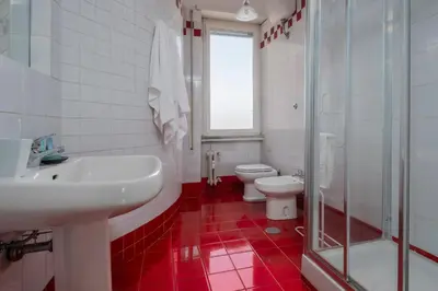 a bathroom with a toilet and a sink and a shower at Vatican Zen House - Cale 05 in Rome