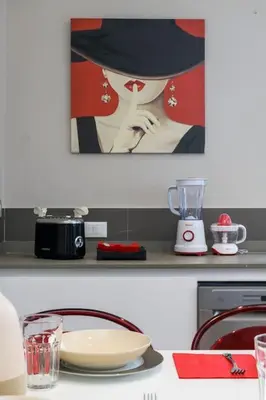a kitchen with a counter with a plate and a blender at San Pietro Nausicaa Penthouse in Rome