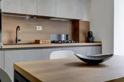 a kitchen with a bowl on a wooden table at San Giovanni Cozy Apt - Home and More in Rome