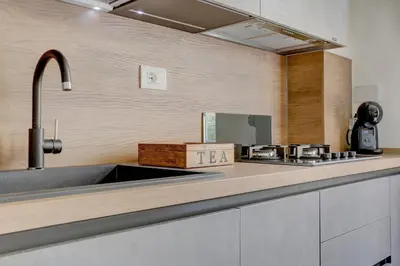 a kitchen with a sink and a counter top at San Giovanni Cozy Apt - Home and More in Rome