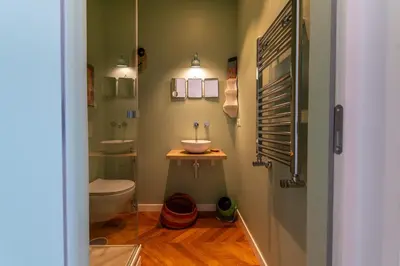 a bathroom with a toilet and a sink in it at Boho 202 in Rome