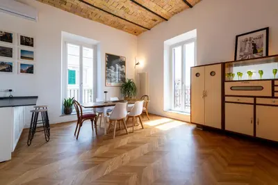 a kitchen and dining room with a table and chairs at Boho 202 in Rome